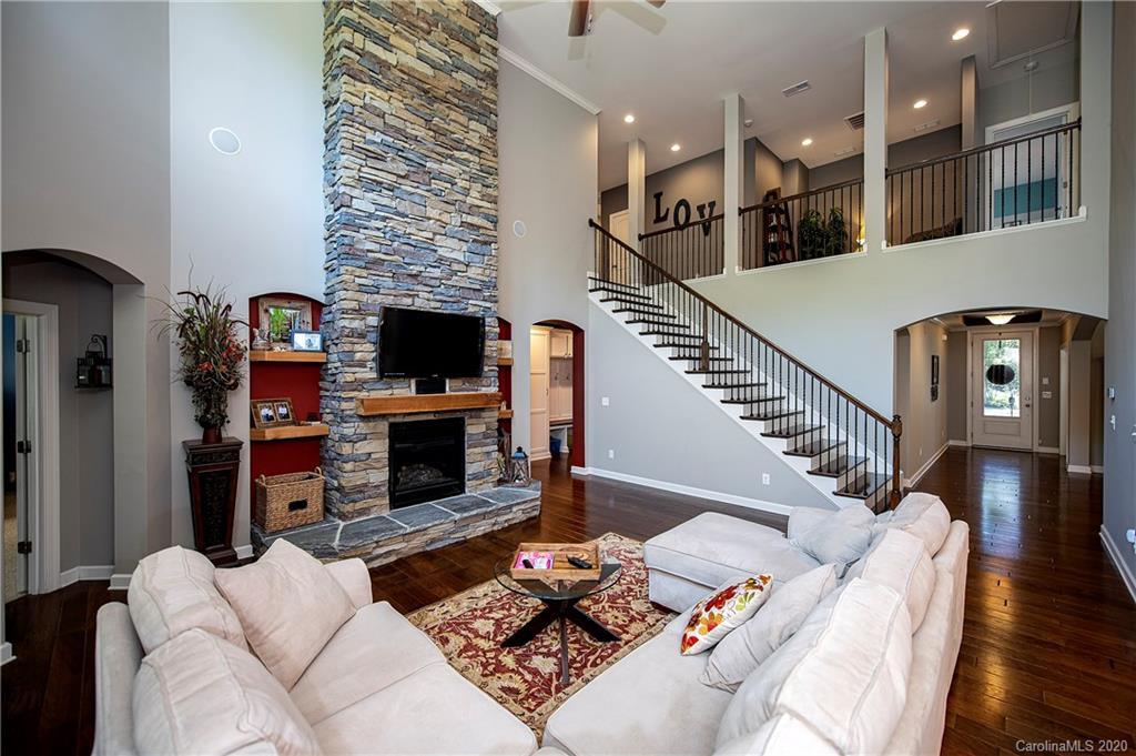 1452 Cilantro Court Tega Cay, SC 29708 - Photo 12 of 48 a living room with furniture and a fireplace