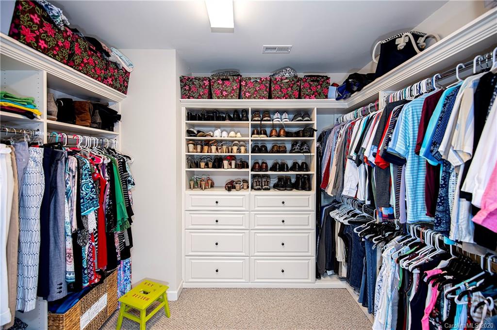 1452 Cilantro Court Tega Cay, SC 29708 - Photo 23 of 48 a view of walk in closet with clothes and shoes