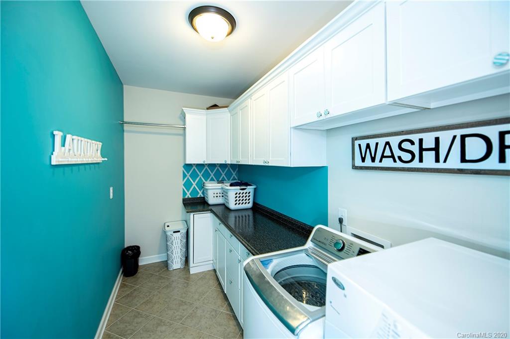 1452 Cilantro Court Tega Cay, SC 29708 - Photo 25 of 48 a kitchen with a refrigerator and a sink