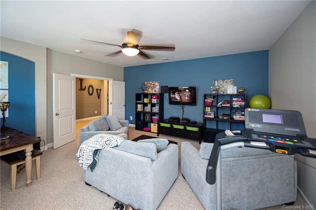 1452 Cilantro Court Tega Cay, SC 29708 - Photo 27 of 48 a bedroom with furniture and a bed