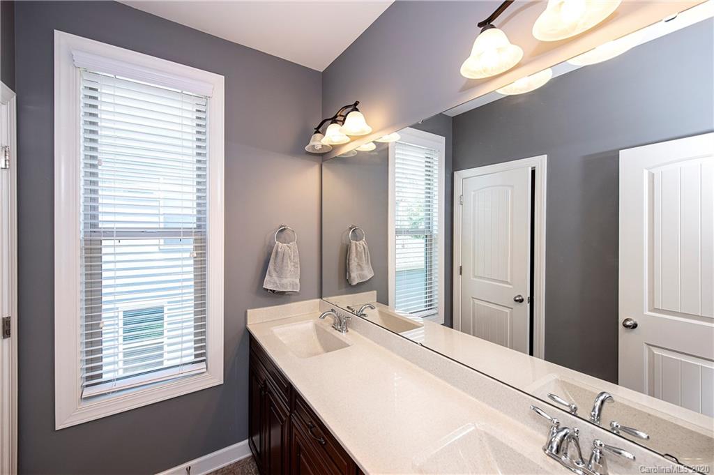 1452 Cilantro Court Tega Cay, SC 29708 - Photo 28 of 48 a bathroom with a sink and a mirror