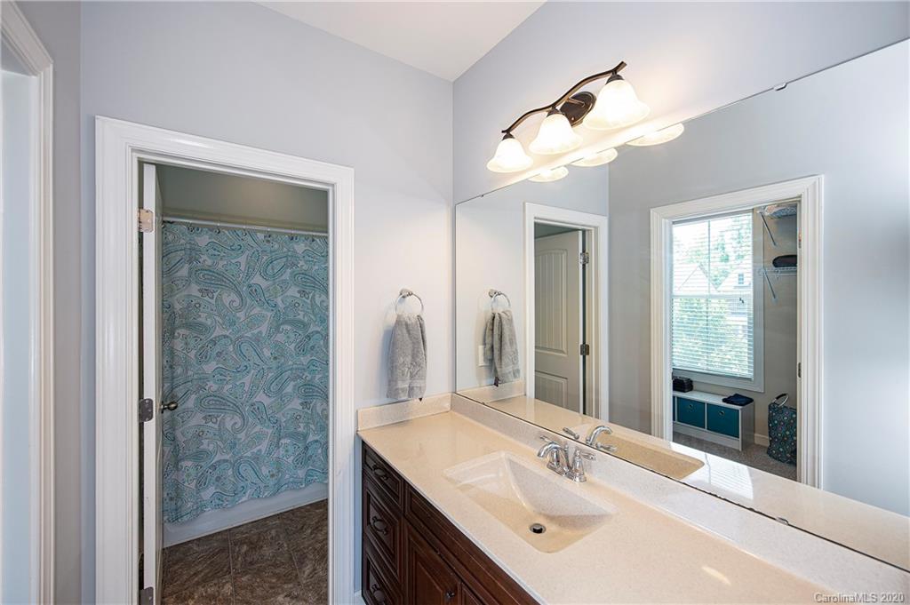 1452 Cilantro Court Tega Cay, SC 29708 - Photo 35 of 48 a bathroom with a sink vanity and a mirror