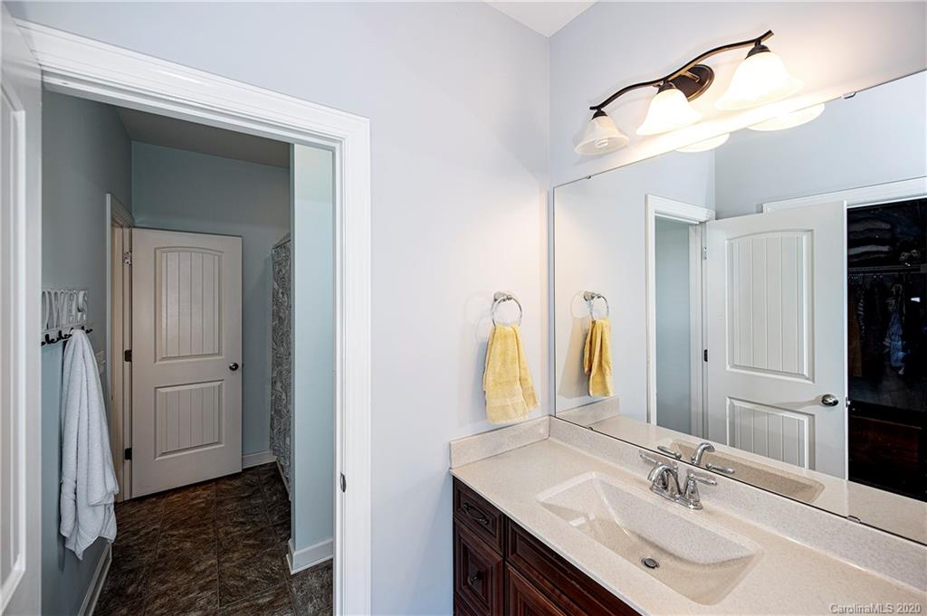 1452 Cilantro Court Tega Cay, SC 29708 - Photo 37 of 48 a bathroom with a sink and a mirror