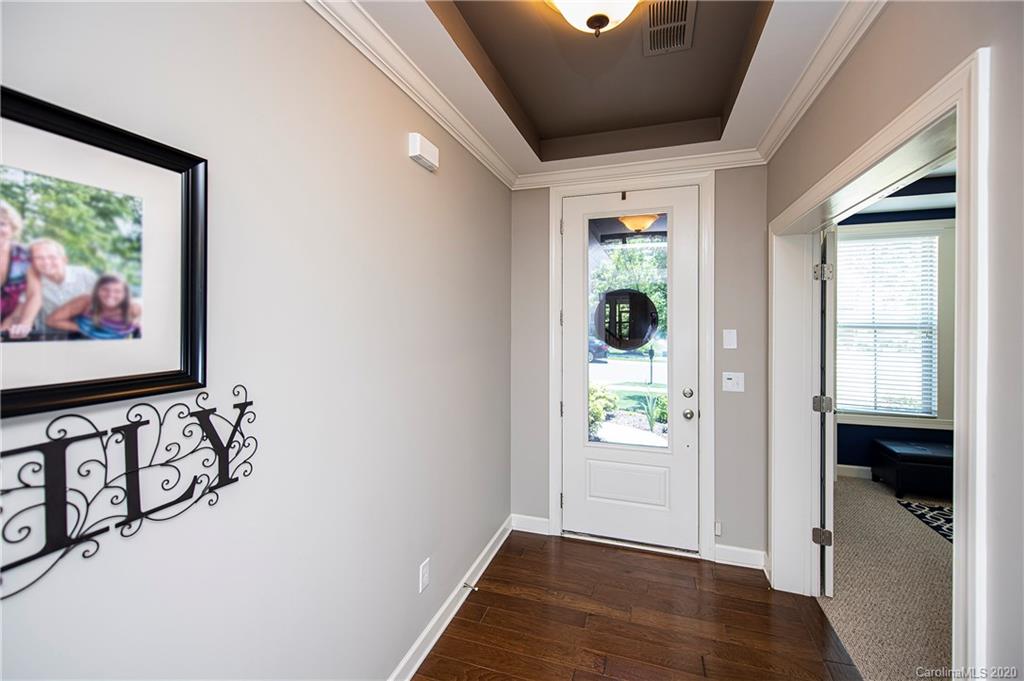 1452 Cilantro Court Tega Cay, SC 29708 - Photo 5 of 48 a view of an entryway with wooden floor