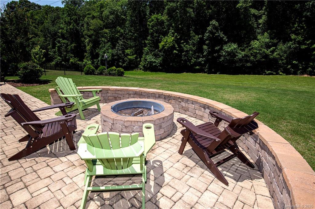1452 Cilantro Court Tega Cay, SC 29708 - Photo 41 of 48 a view of a chairs and table in the garden