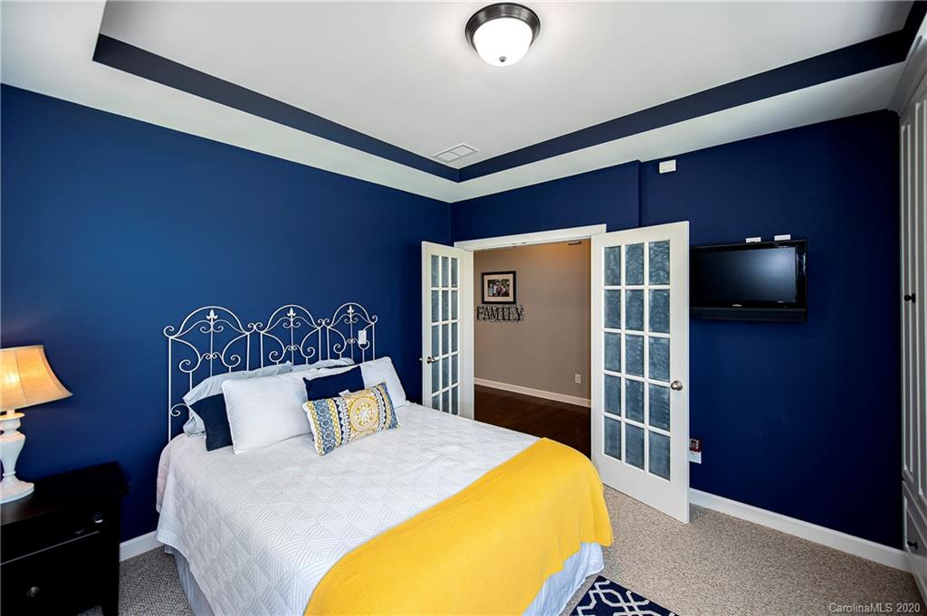 1452 Cilantro Court Tega Cay, SC 29708 - Photo 7 of 48 a bed sitting in a bedroom next to a window
