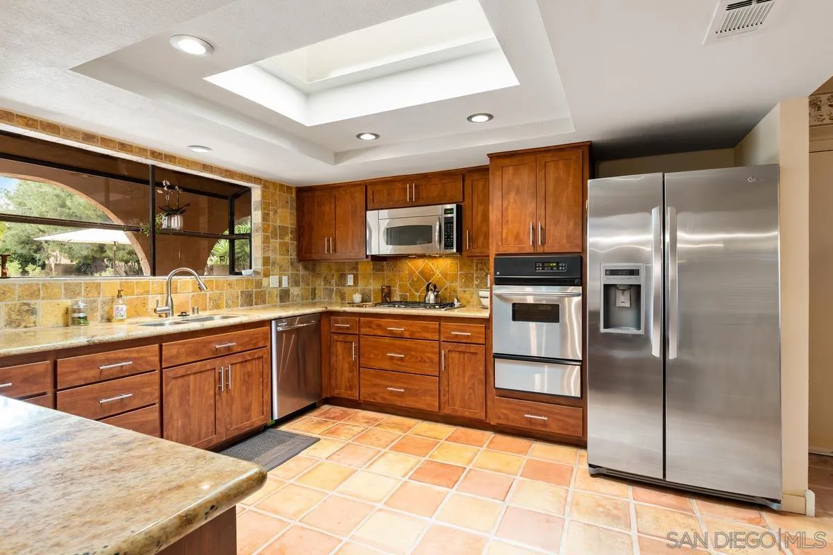 13767 Proctor Valley Road Jamul, CA 91935 - Photo 14 of 50 a kitchen with granite countertop stainless steel appliances cabinets and a sink