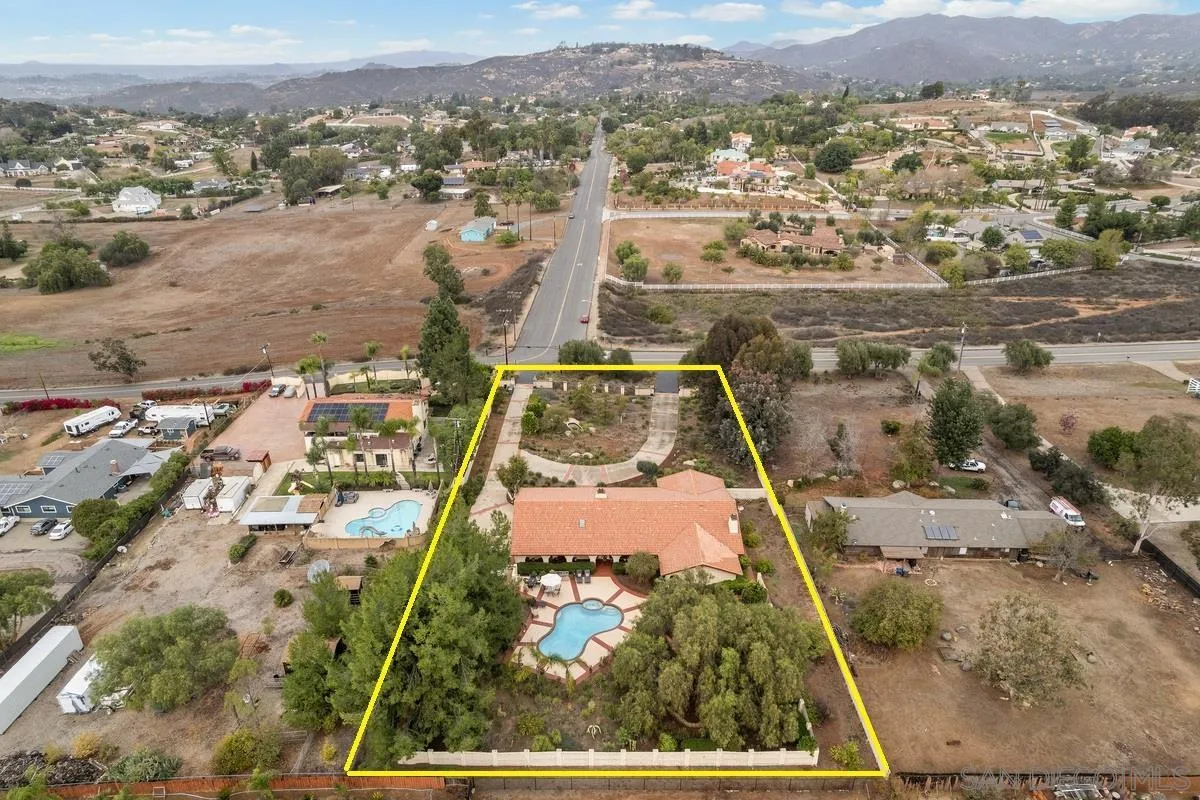 13767 Proctor Valley Road Jamul, CA 91935 - Photo 2 of 50 an aerial view of residential houses with outdoor space
