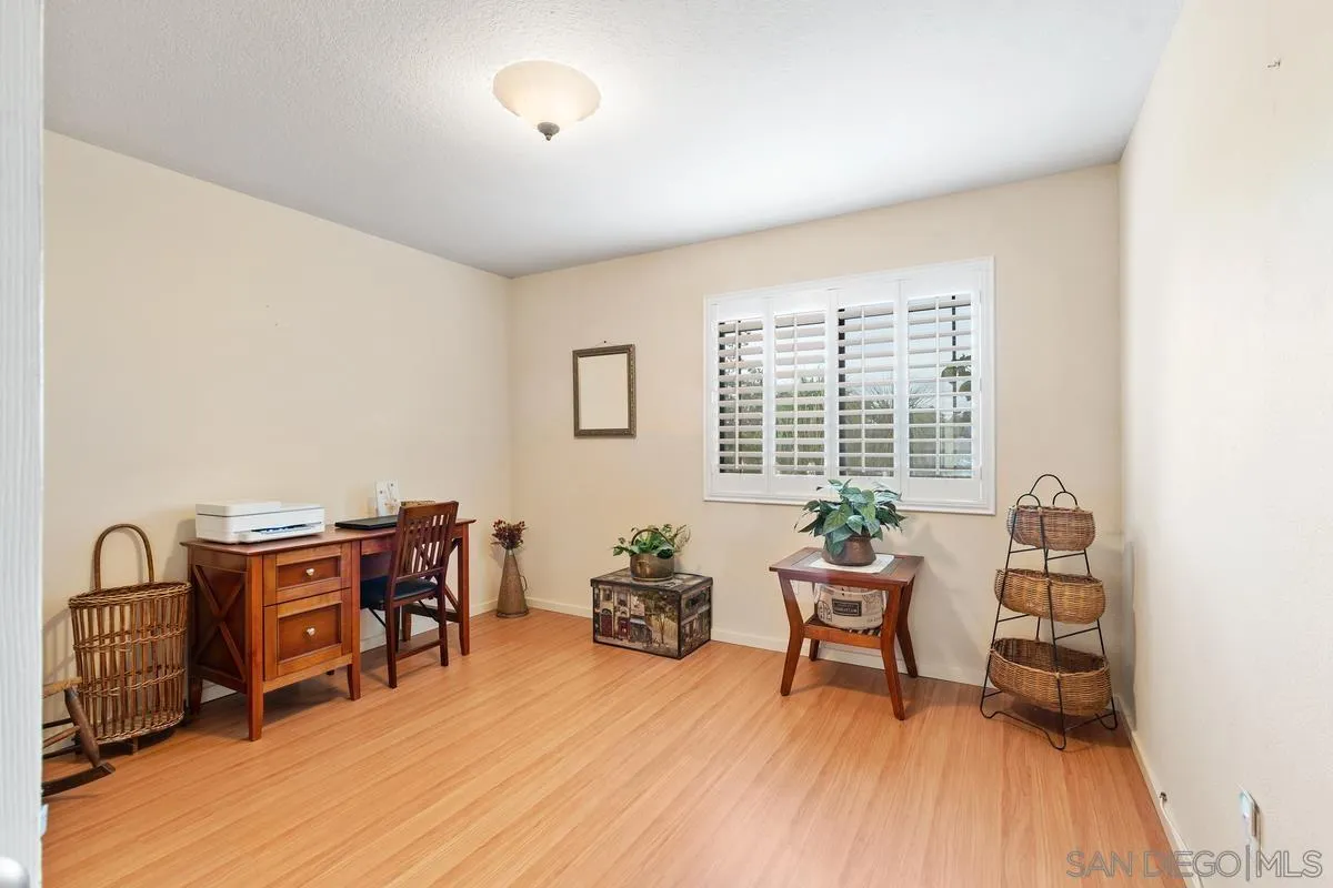 13767 Proctor Valley Road Jamul, CA 91935 - Photo 30 of 50 a living room with furniture and a wooden floor