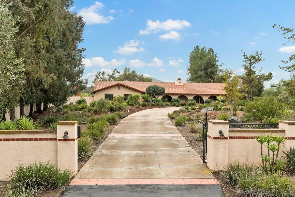 13767 Proctor Valley Road Jamul, CA 91935 - Photo 41 of 50 a front view of a house with a yard
