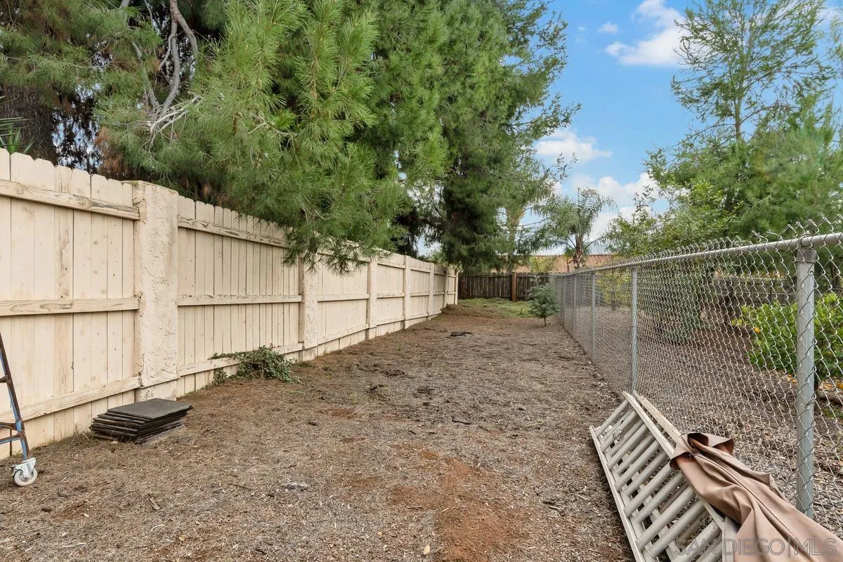 13767 Proctor Valley Road Jamul, CA 91935 - Photo 42 of 50 a backyard of a house with a barn