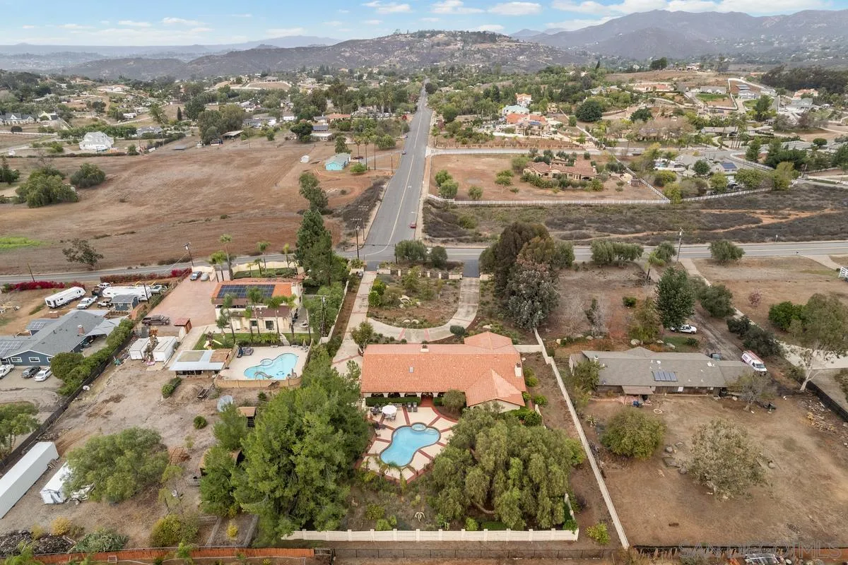 13767 Proctor Valley Road Jamul, CA 91935 - Photo 46 of 50 an aerial view of residential building and parking space