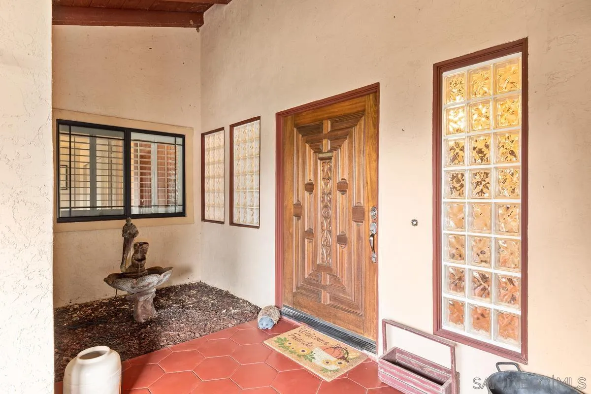 13767 Proctor Valley Road Jamul, CA 91935 - Photo 7 of 50 a bedroom with a bed and a window