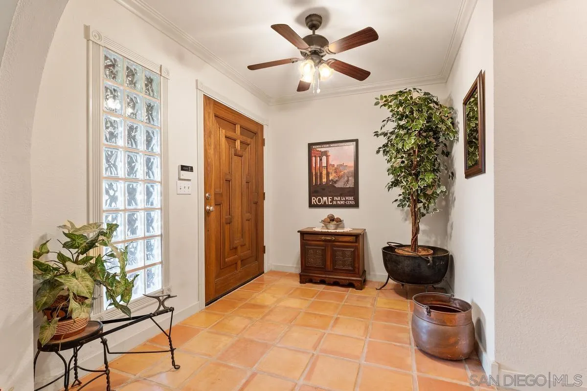 13767 Proctor Valley Road Jamul, CA 91935 - Photo 8 of 50 a living room with furniture and a potted plant