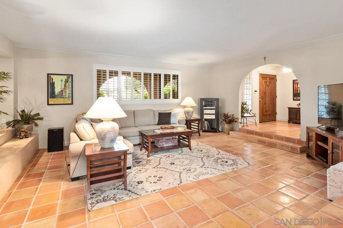 13767 Proctor Valley Road Jamul, CA 91935 - Photo 10 of 50 a living room with furniture a fireplace and a table