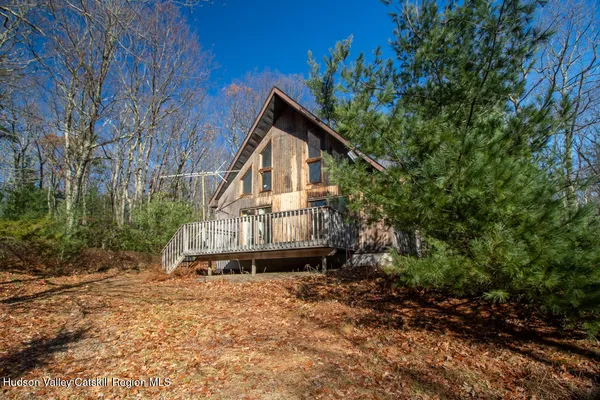 a house with trees in the background