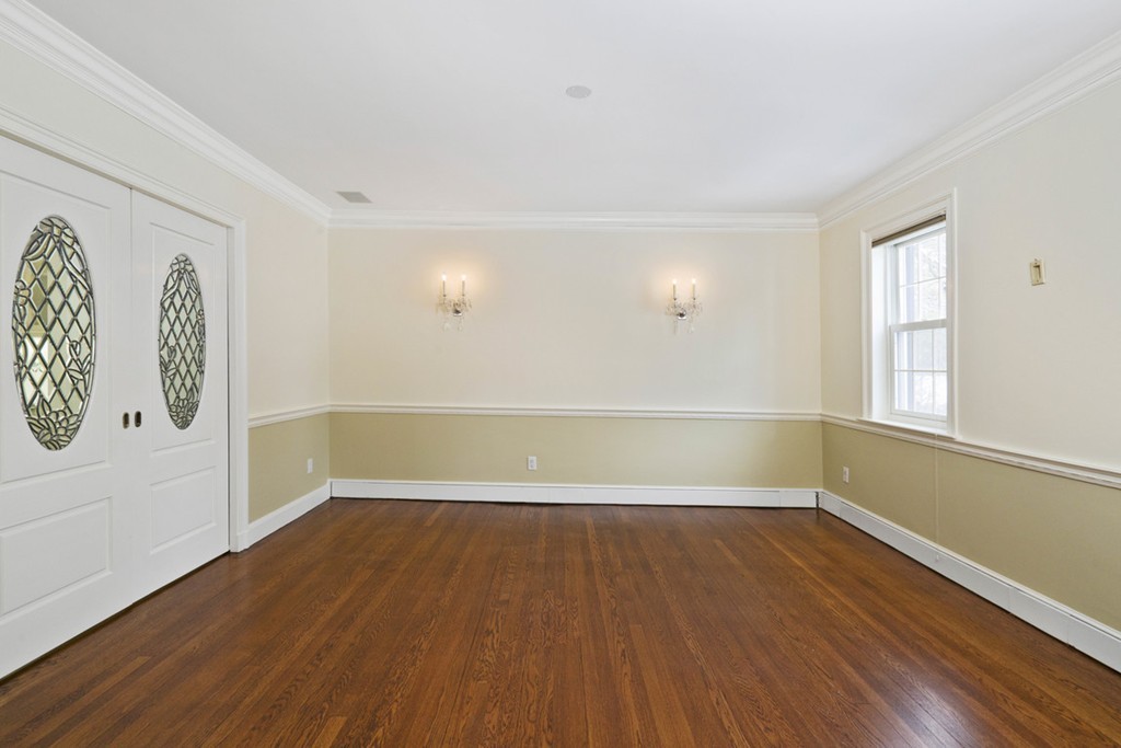 142 Neshobe Road Newton, MA 02468 - Photo 14 of 29 an empty room with wooden floor and windows
