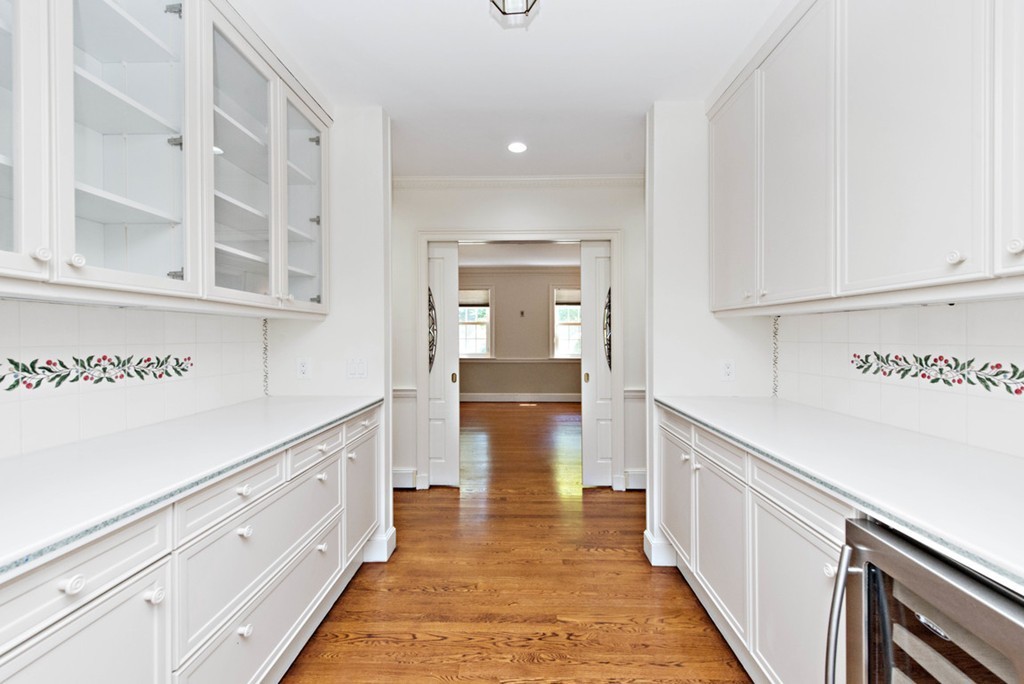 142 Neshobe Road Newton, MA 02468 - Photo 15 of 29 a hallway with cabinets