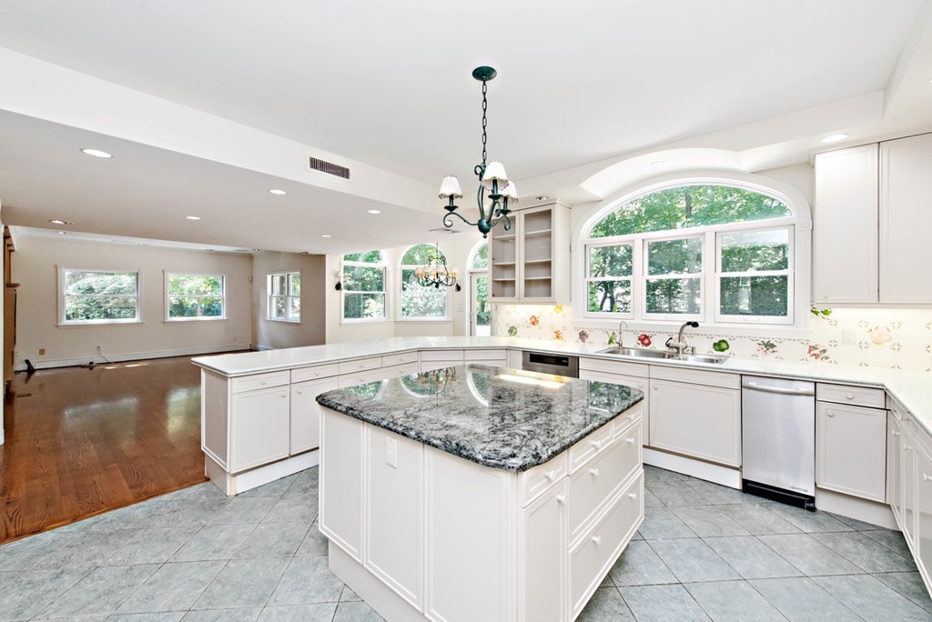 142 Neshobe Road Newton, MA 02468 - Photo 16 of 29 a kitchen with center island and windows