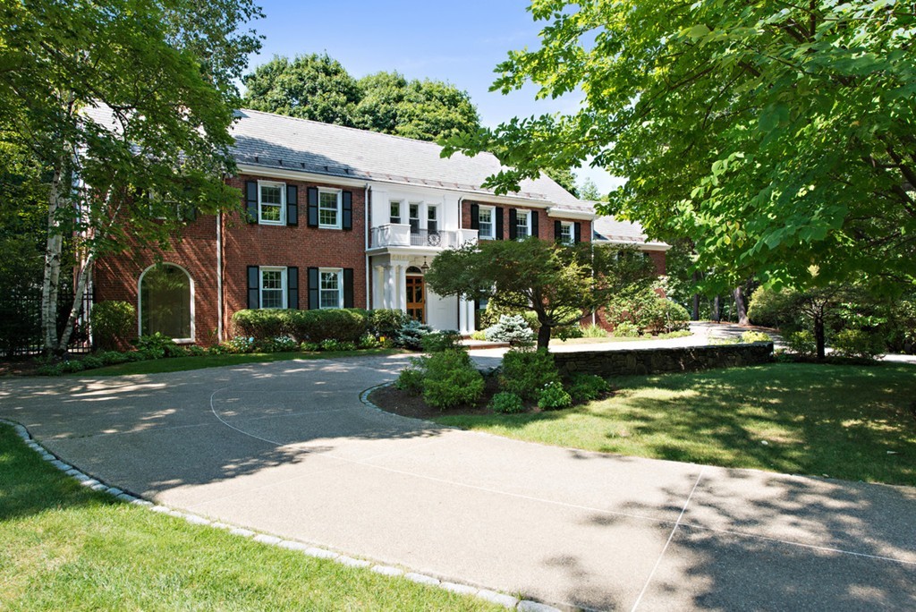 142 Neshobe Road Newton, MA 02468 - Photo 2 of 29 a front view of a house with a garden and trees