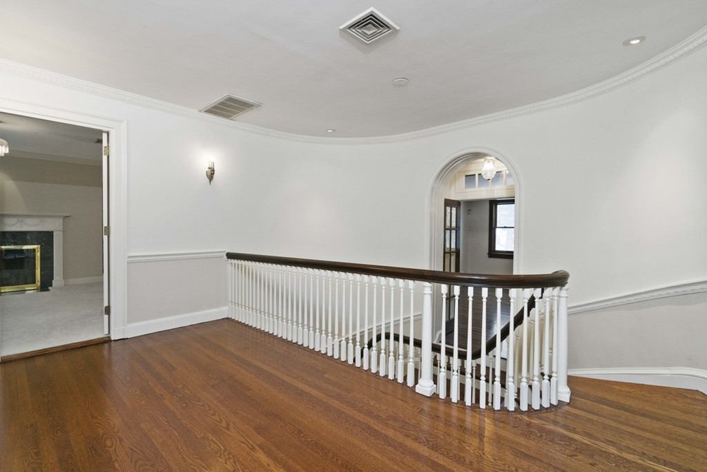 142 Neshobe Road Newton, MA 02468 - Photo 22 of 29 a view of hallway with wooden floor