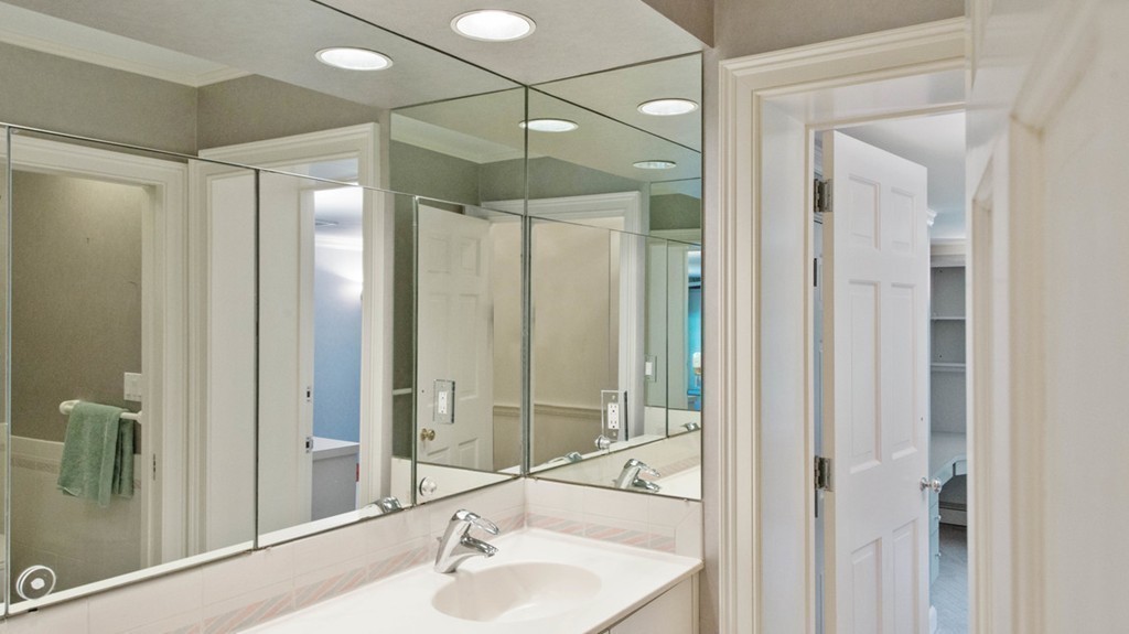 142 Neshobe Road Newton, MA 02468 - Photo 28 of 29 a bathroom with a shower sink and mirror