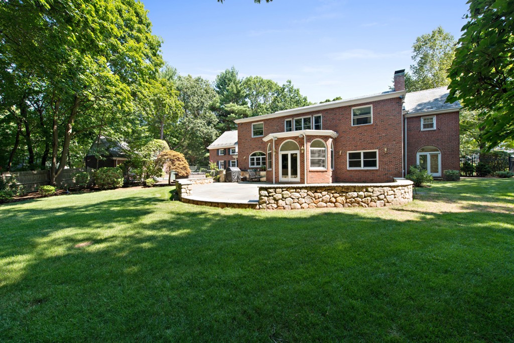 142 Neshobe Road Newton, MA 02468 - Photo 4 of 29 a front view of a house with garden and trees
