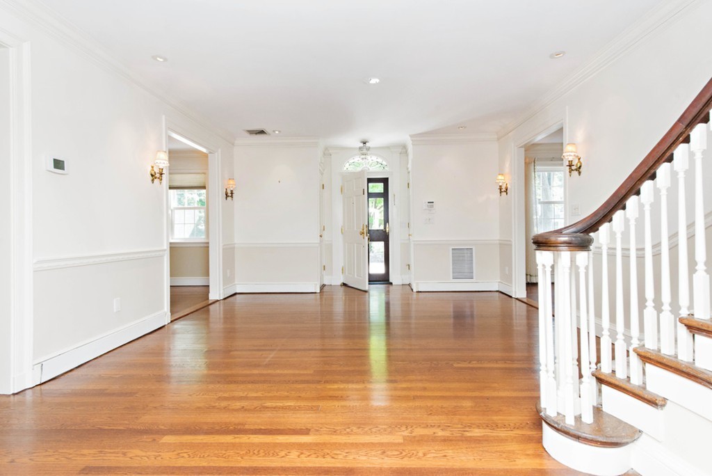 142 Neshobe Road Newton, MA 02468 - Photo 7 of 29 a view of an empty room with wooden floor and a window