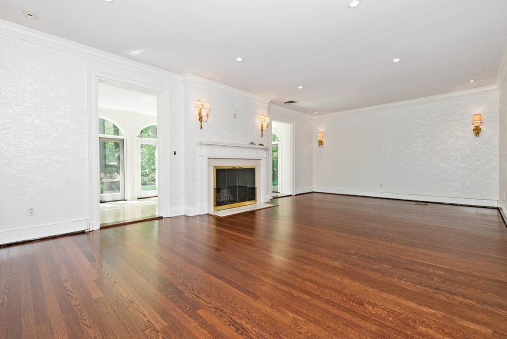 142 Neshobe Road Newton, MA 02468 - Photo 10 of 29 a view of an empty room with wooden floor and a window