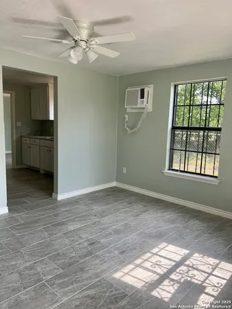 a view of an empty room with a window