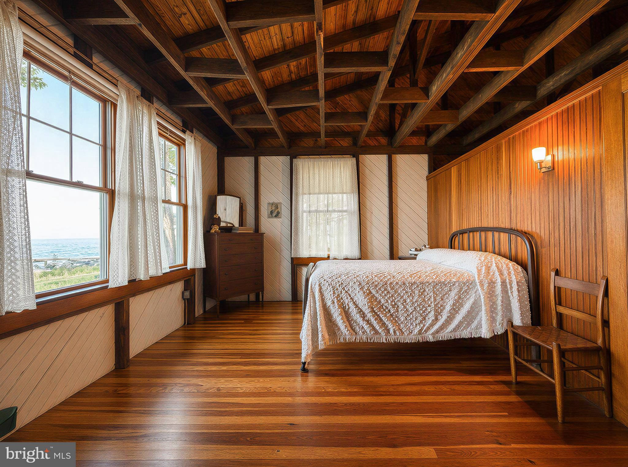 18167 River Road Tall Timbers, MD 20690 - Photo 20 of 62 a spacious bedroom with a large bed and a large window