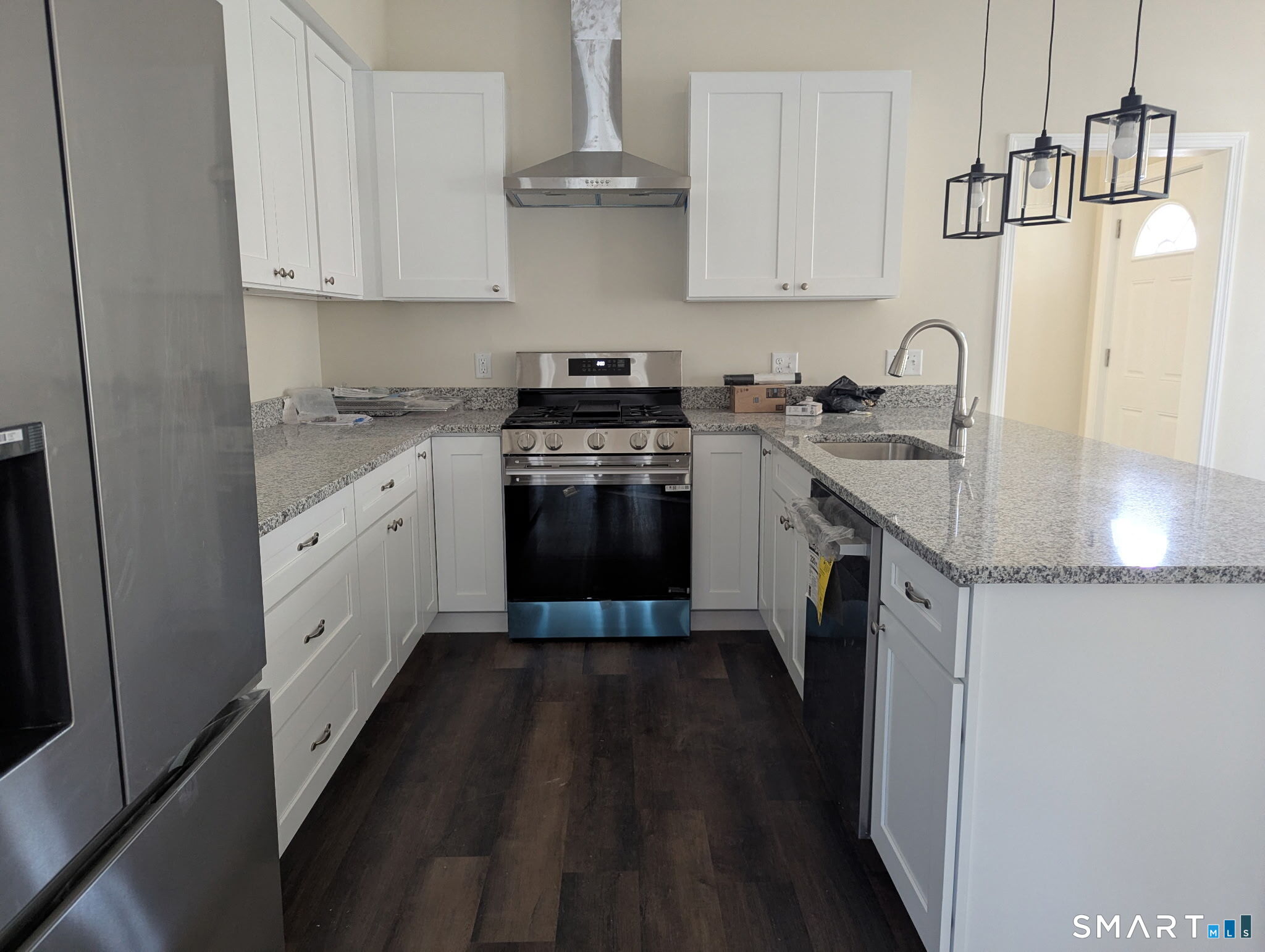 647 Broadview Terrace Hartford, CT 06106 - Photo 7 of 12 a kitchen with granite countertop a sink stove and cabinets