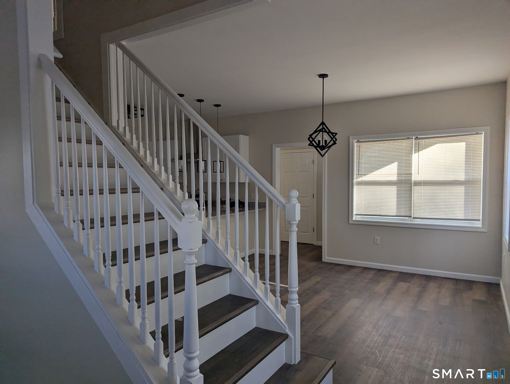 647 Broadview Terrace Hartford, CT 06106 - Photo 9 of 12 a view of staircase with wooden floor and white walls