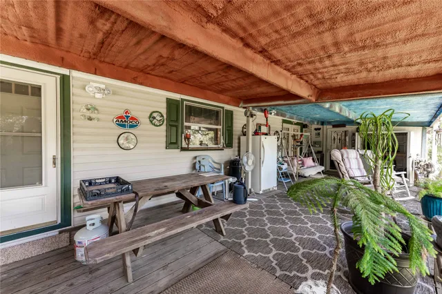 a view of a chairs and table in a patio