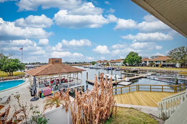 a view of a balcony with seating space