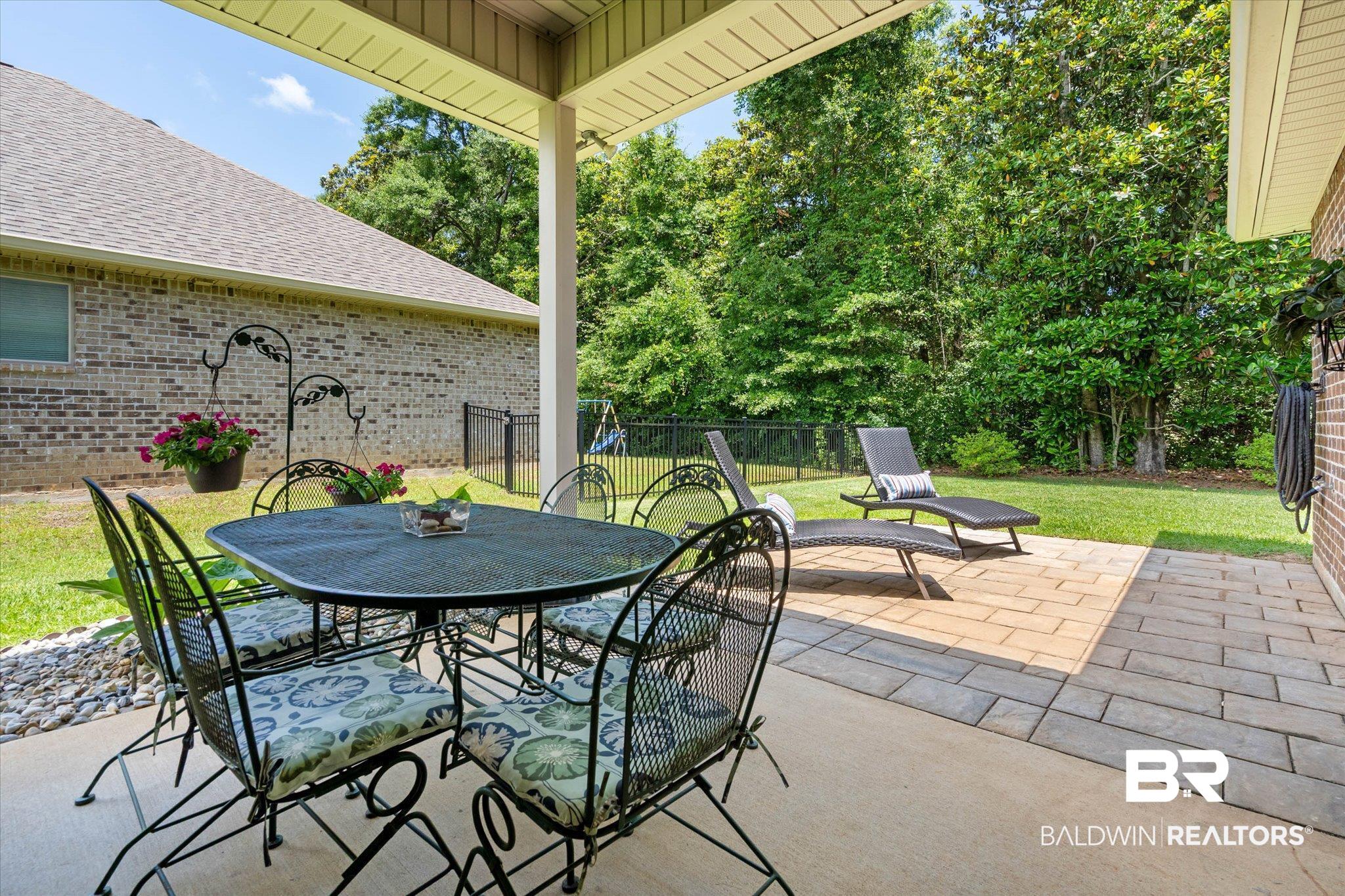 1270 Surrey Loop Foley, AL 36535 - Photo 21 of 27 Covered patio featuring an overhead ceiling fan, concrete flooring, and a paver extension