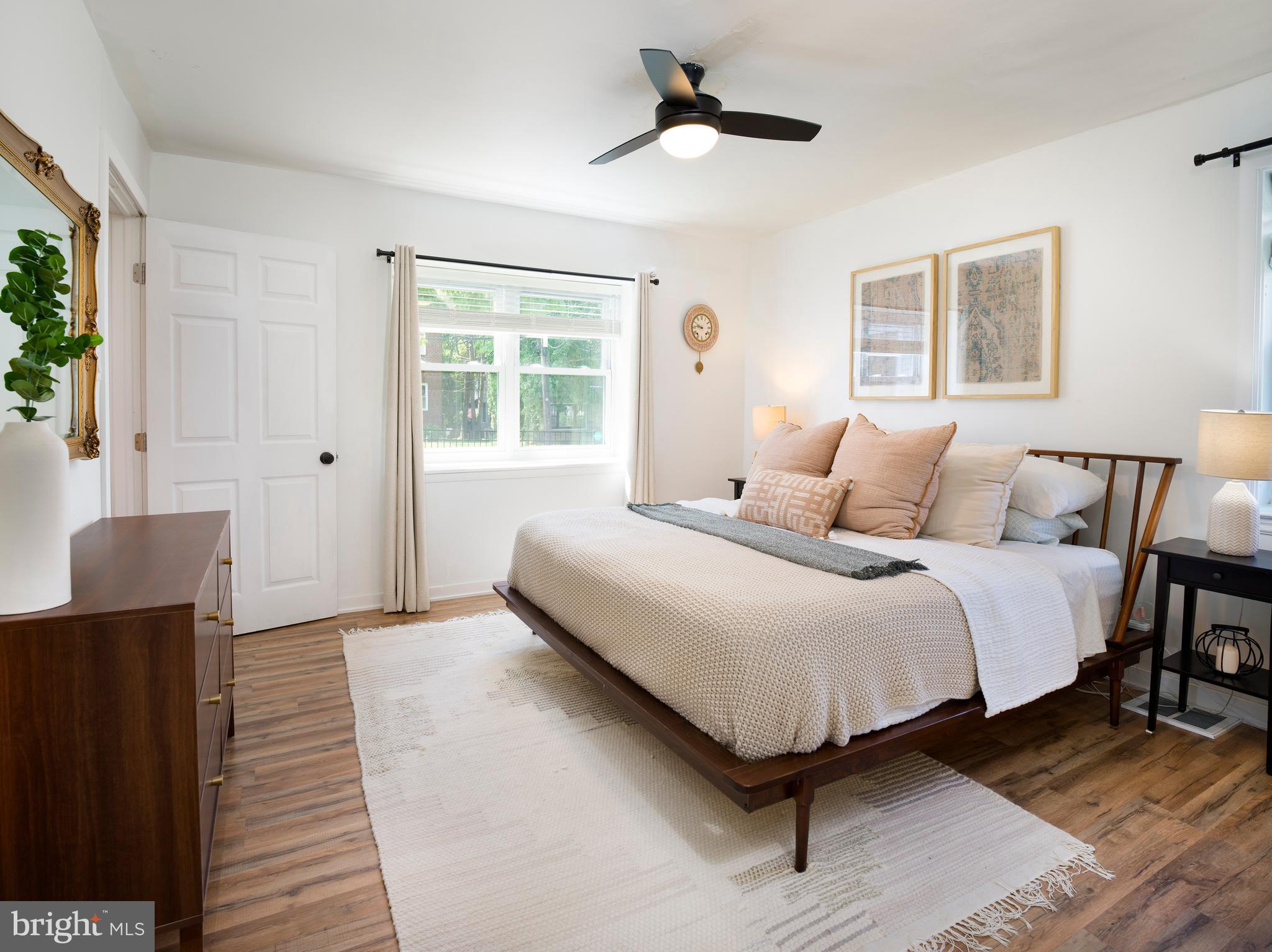 1455 Manoa Road Wynnewood, PA 19096 - Photo 13 of 27 a bedroom with a bed lamp closet and window