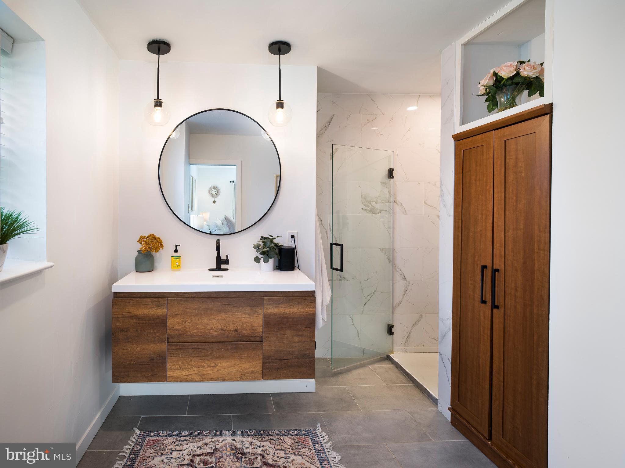 1455 Manoa Road Wynnewood, PA 19096 - Photo 15 of 27 a bathroom with a sink mirror and vanity