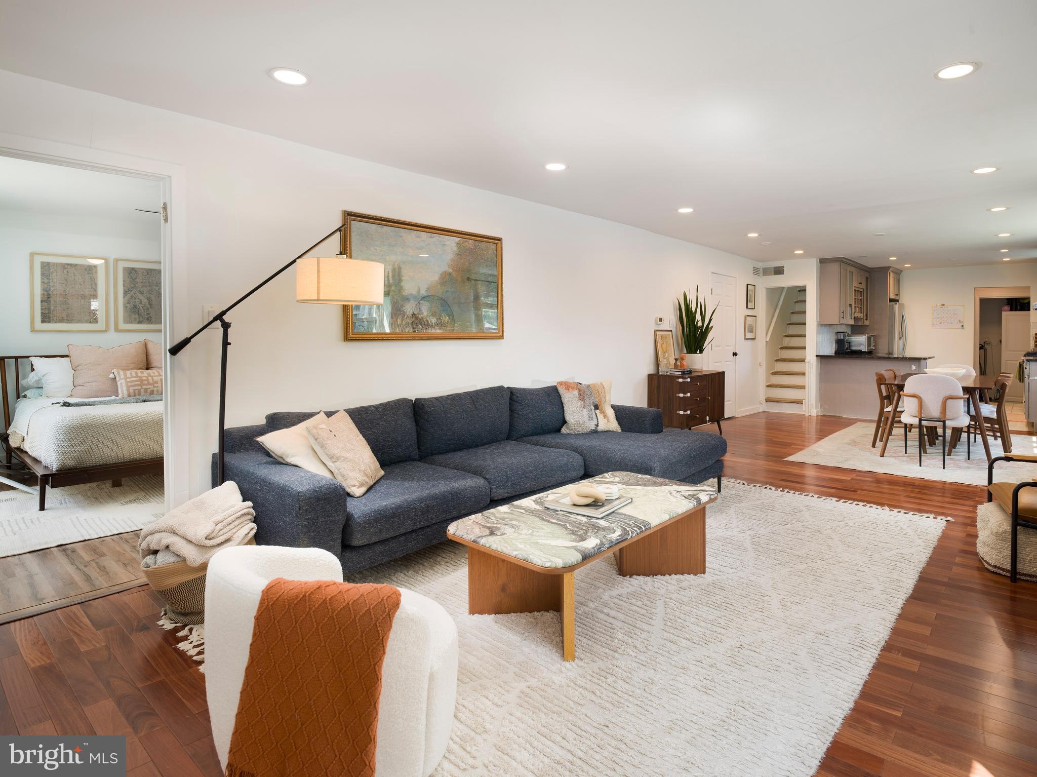 1455 Manoa Road Wynnewood, PA 19096 - Photo 8 of 27 a living room with furniture and a dining table with wooden floor
