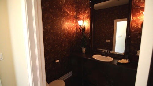 6 North 42nd Road Mendota, IL 61342 - Photo 17 of 25 a bathroom with a granite countertop sink and a mirror