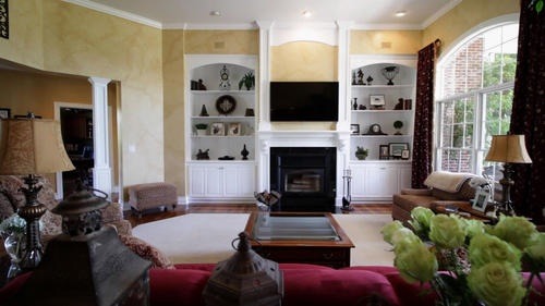 6 North 42nd Road Mendota, IL 61342 - Photo 3 of 25 a living room with furniture a flat screen tv and a fireplace
