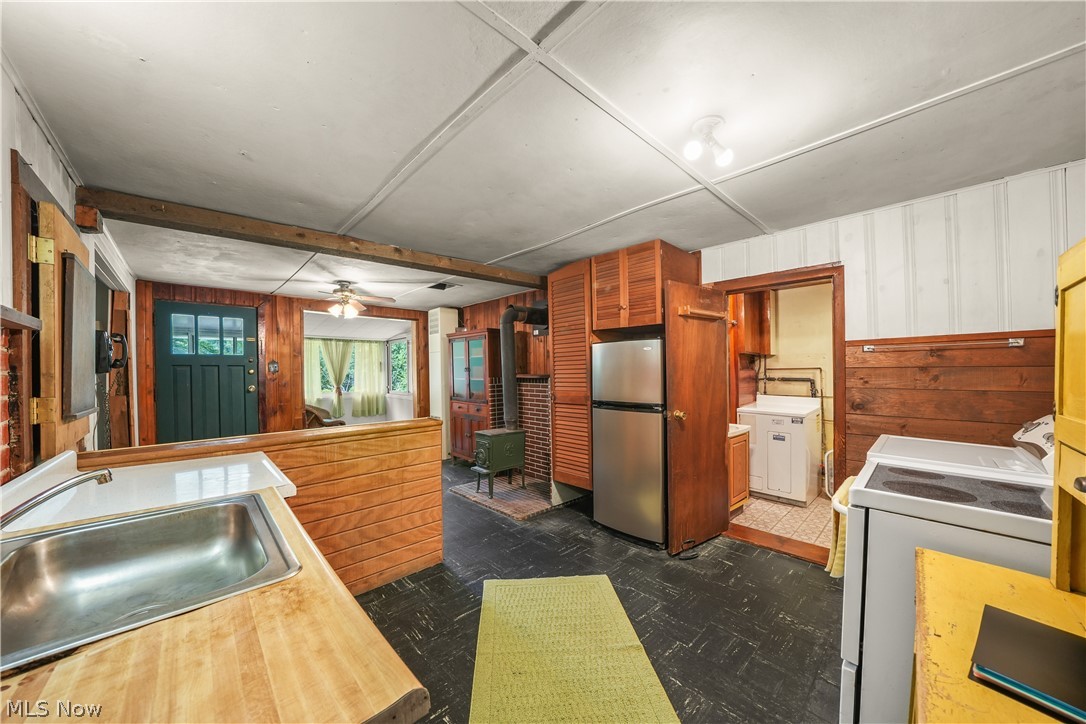 13280 Main Market Road Burton, OH 44021 - Photo 8 of 19 Wood-finish countertops with an integrated stainless steel sink