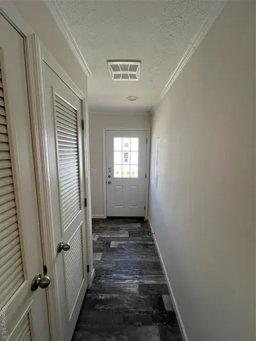 a view of a hallway with windows