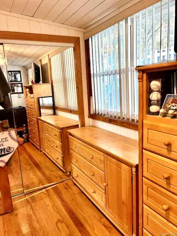 a large kitchen with kitchen island a sink a counter top space and appliances