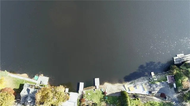 a view of an house with backyard porch and sitting area