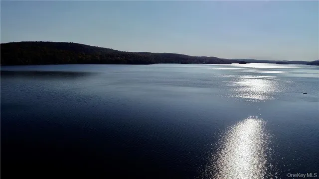 a view of a deck with wooden floor and fence