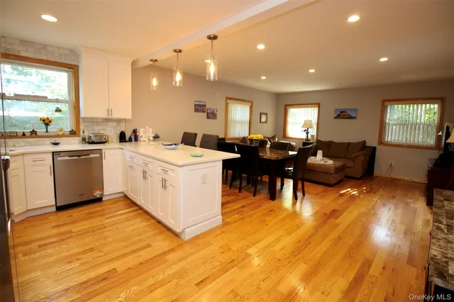 a close up of a vase of flowers sitting on a table
