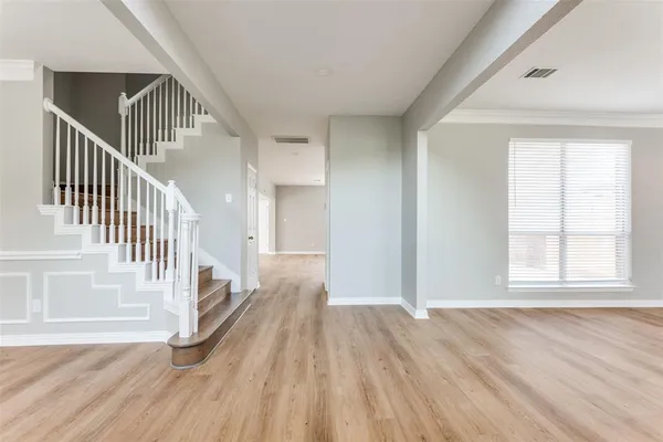 a view of entryway with wooden floor
