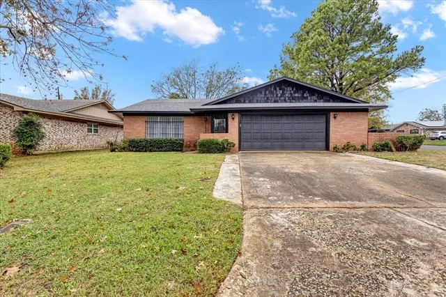 a front view of a house with yard