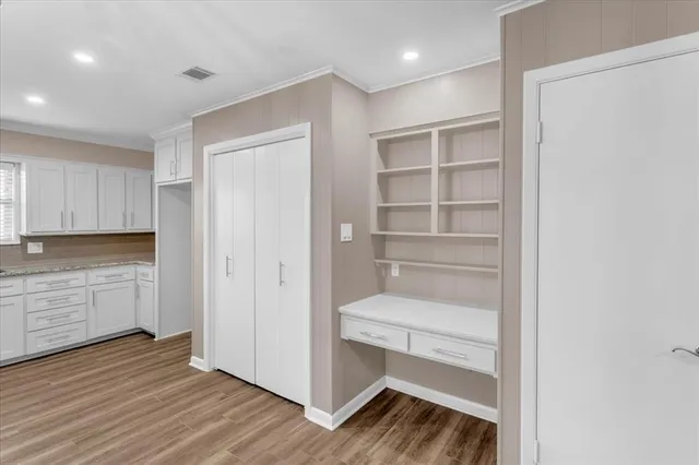 a storage room with wooden floor